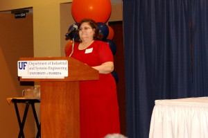 A speaker stands at a podium