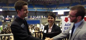 Two men shake hands at the career showcase