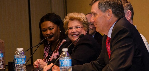 Linda Parker Hudson sits at a panel