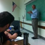 Charles Frock delivers a lecture to students