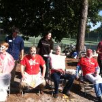 A group of faculty take a seat after being pied in the face