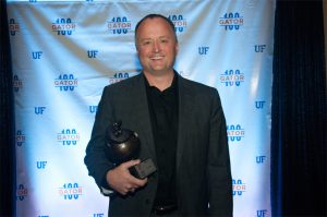 Mike Cottmeyer receiving a Gator 100 award