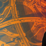 Dr. David Kaber's profile picture, superimposed over an aerial shot of roadways